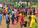 group of kids fetching water